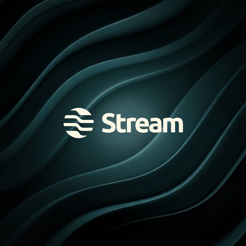 A joyful man holding a phone with the Stream app logo
